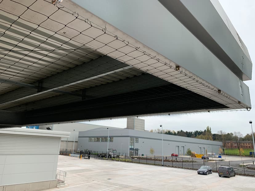 Bird netting installation on building eaves